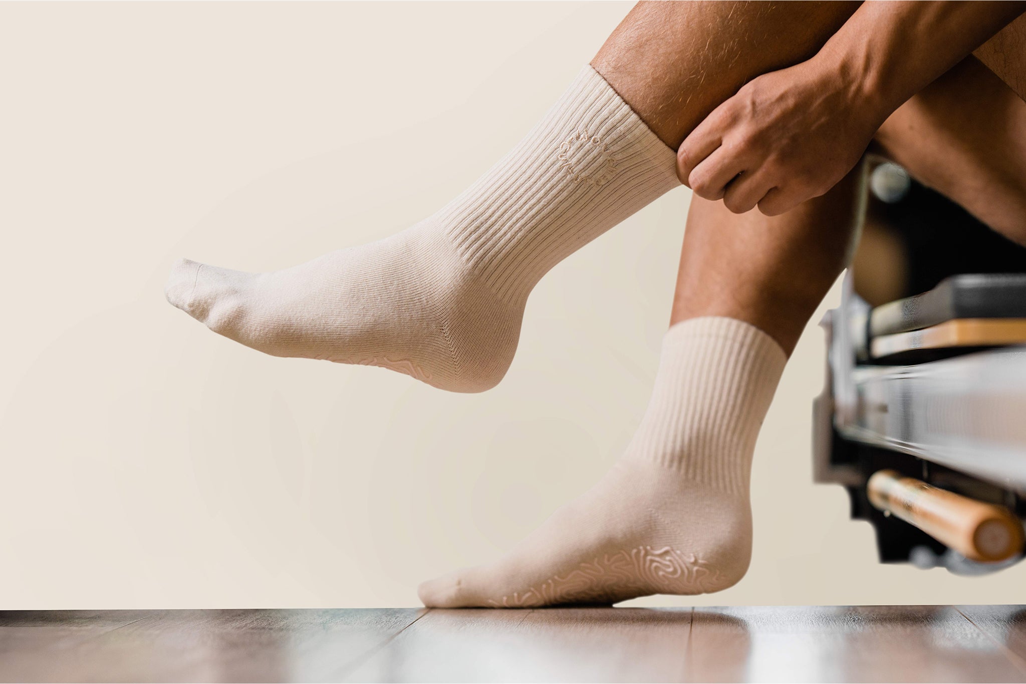 Ivory organic cotton grip socks worn during Pilates exercise – Woven Culture