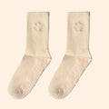 Cream organic cotton grip socks with non-slip sole and Woven Culture logo, sustainable yoga and Pilates socks.